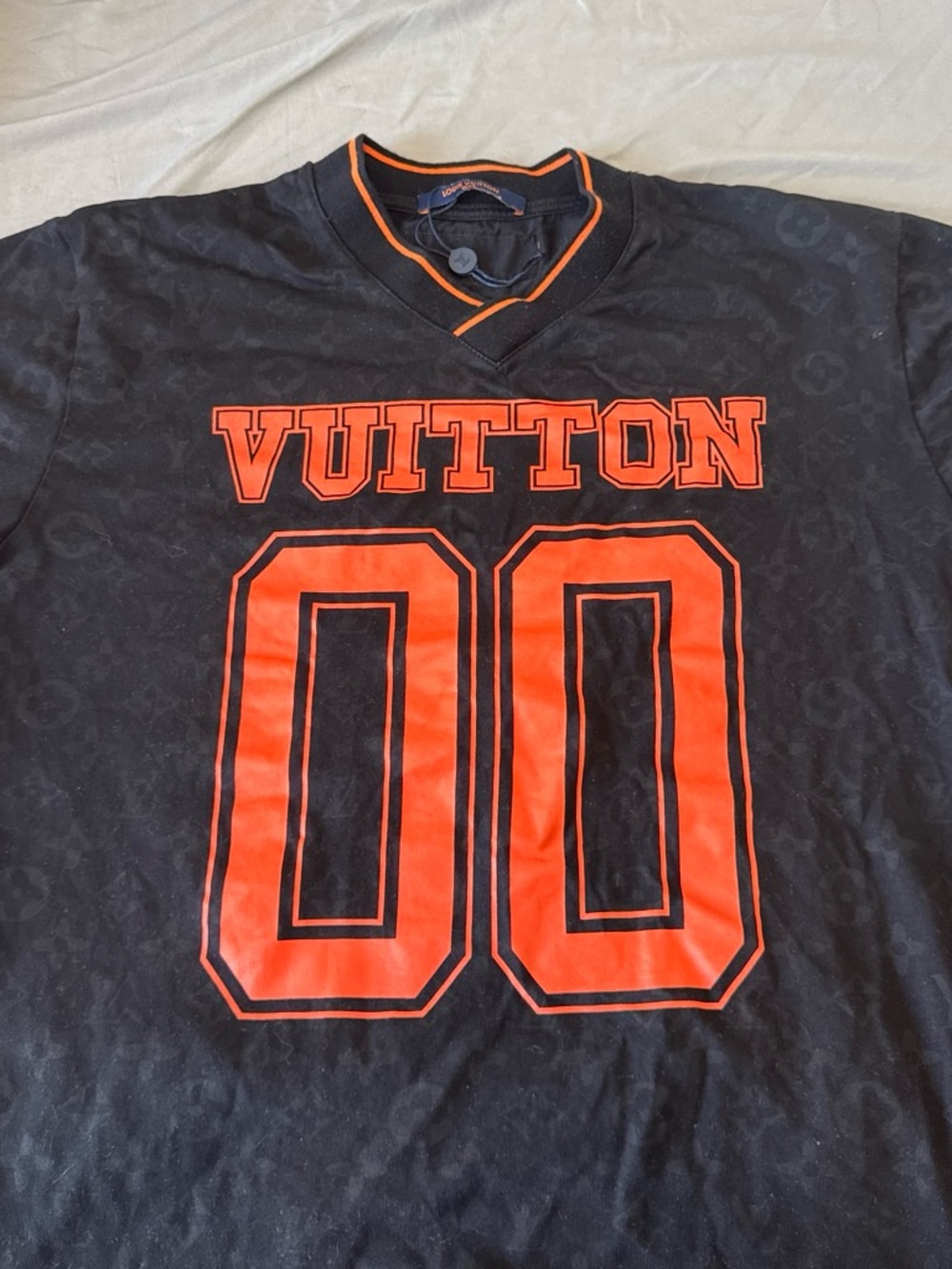 Louis Vuitton Black Shirt with Bold Orange 'VUITTON' and 00 Graphic